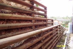 Treated pine slab retaining wall